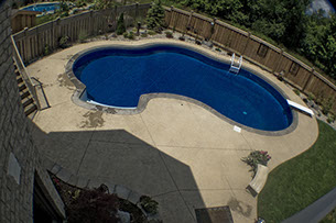 Blue Crystal Clear Swimming Pool with Rock Waterfall, Beautiful Backyard built by Flandscape in London Ontario
